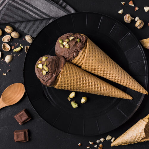 top view set ice cream cones with chocolate