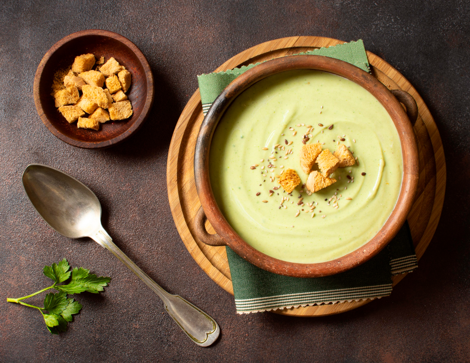 broccoli soup winter food with croutons top view