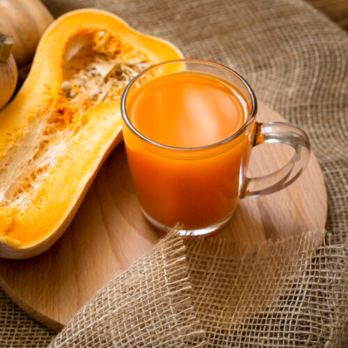 fresh juice with halved pumpkin assortment