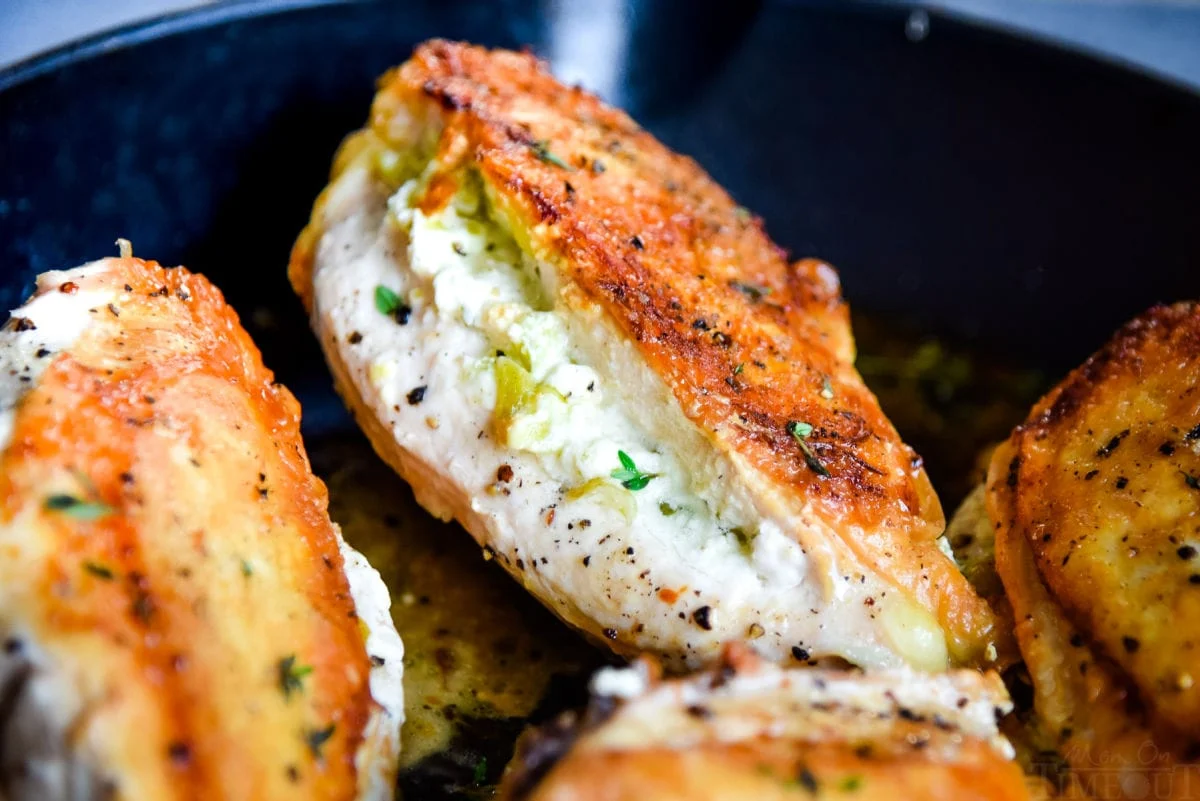goat cheese stuffed chicken in skillet