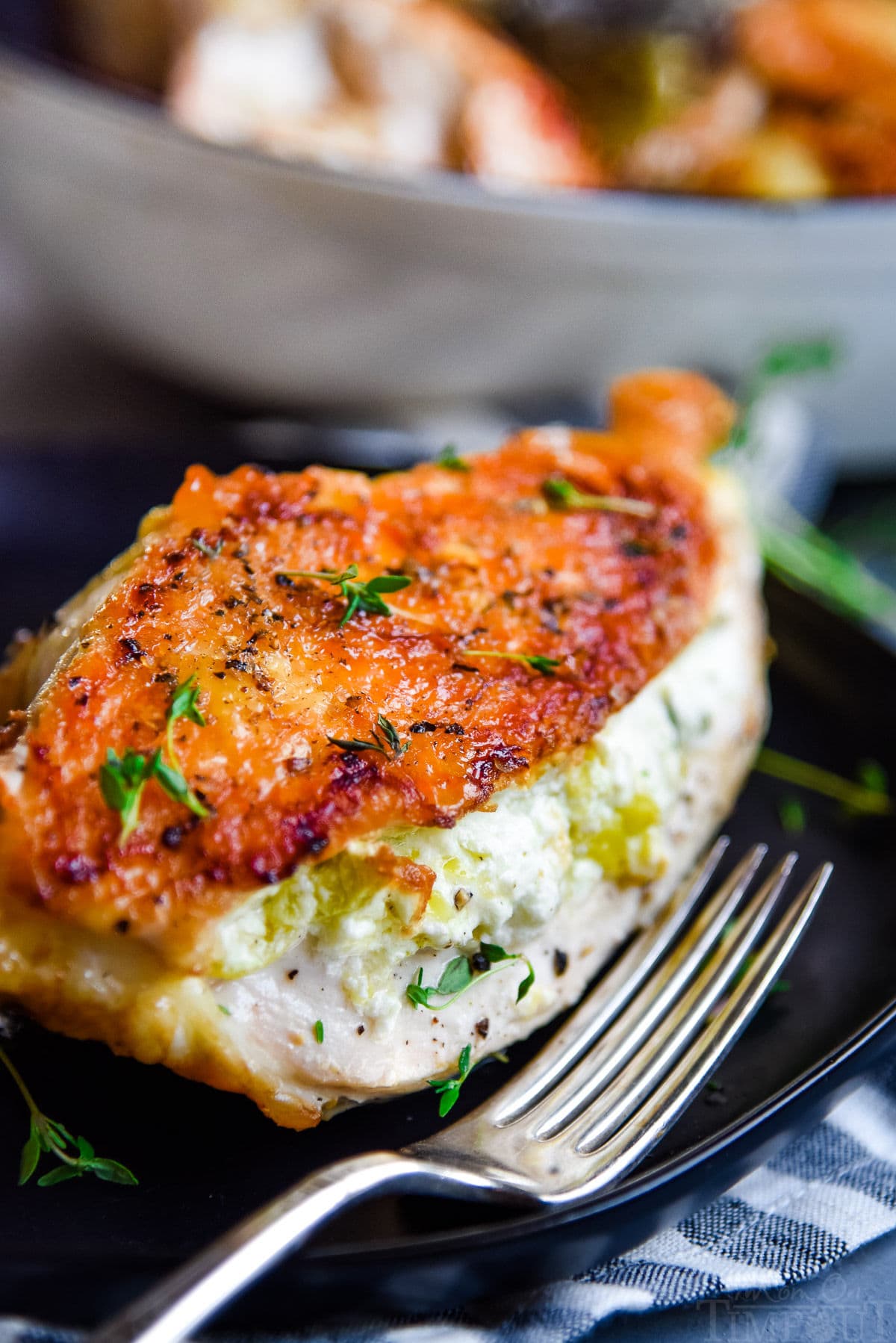 goat cheese stuffed chicken on plate