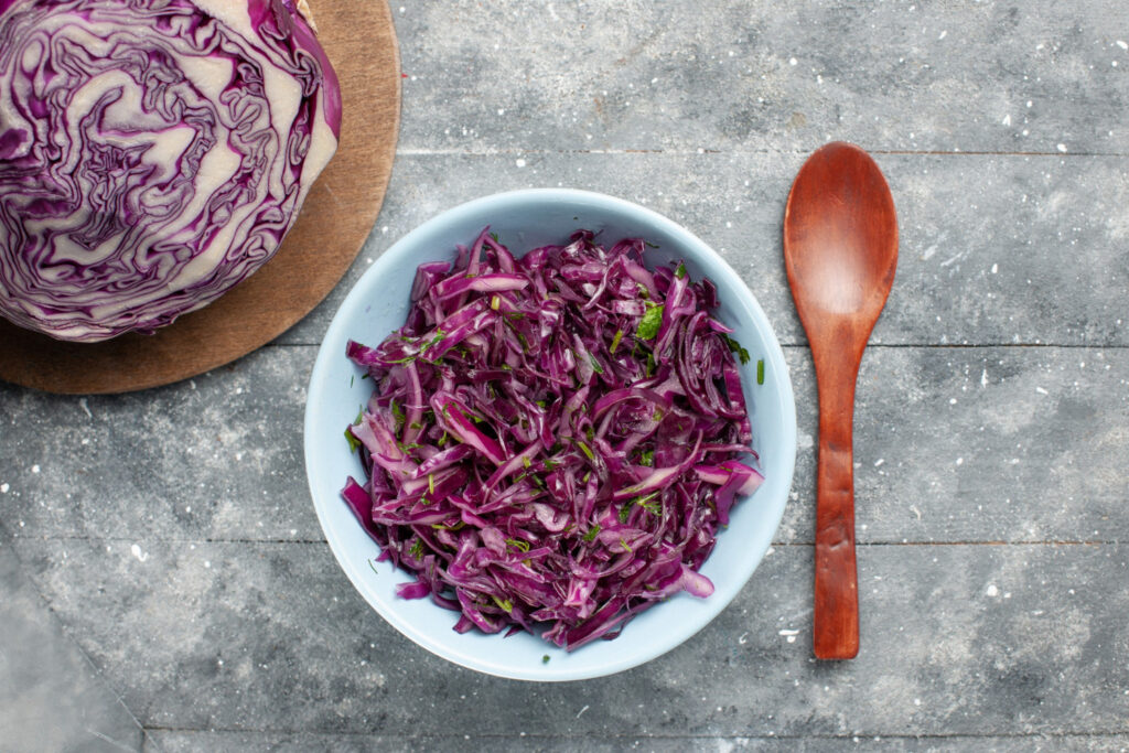 top view fresh sliced cabbage purple cabbage whole sliced grey desk vegetable salad fresh ripe