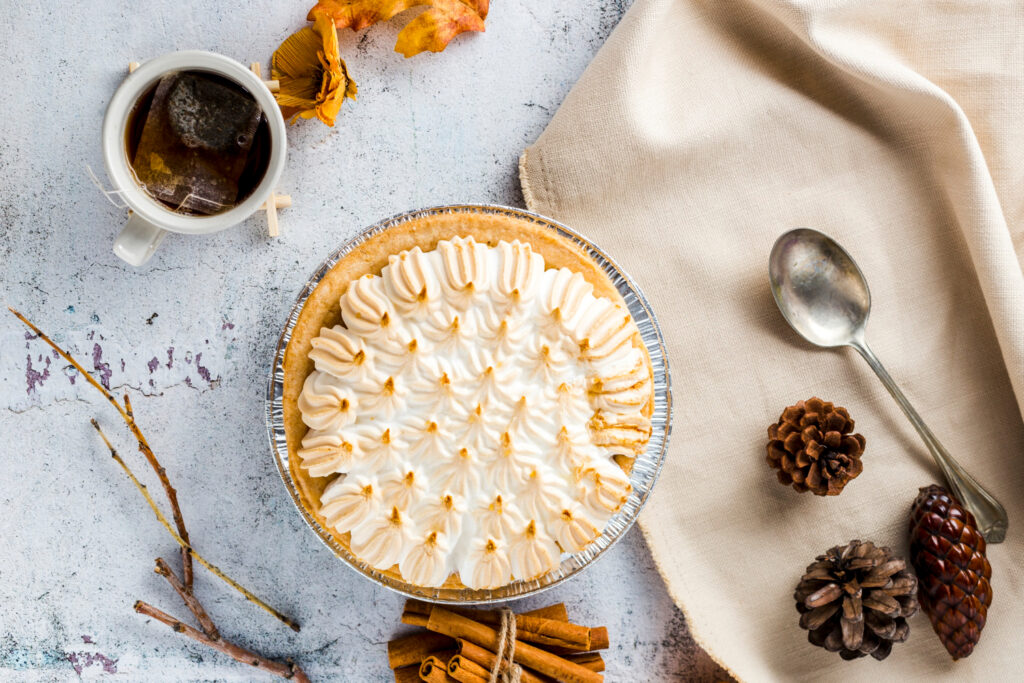 top view meringue pie with autumn decoration
