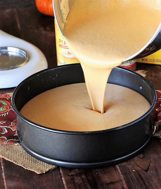 Pumpkin Cheesecake Pouring Batter in Pan Image