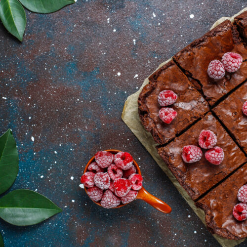 chocolate brownie cake dessert slices with raspberries spices top view