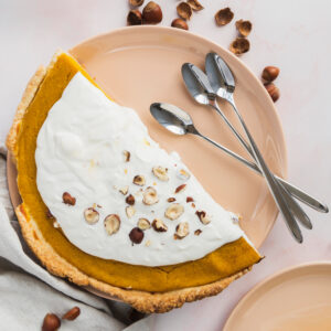 flat lay delicious pie with hazelnuts
